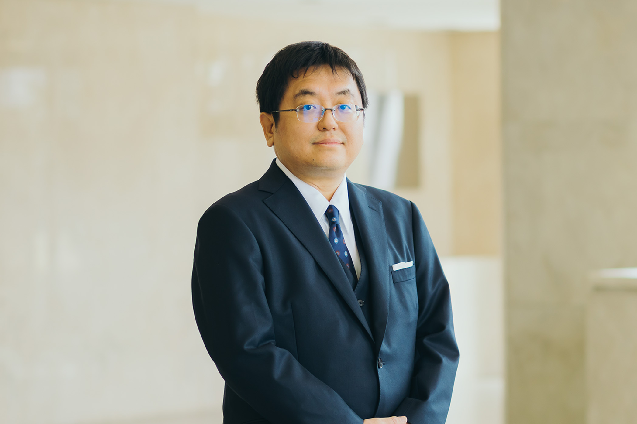 総合政策研究科長・経済・経営学専攻長 八田 真行